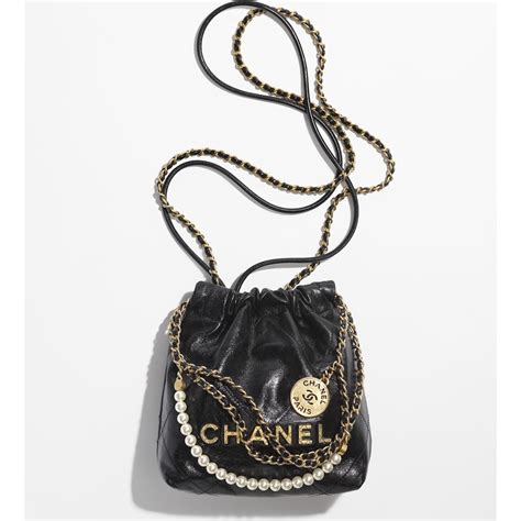 chanel tote bag gold chain|Chanel bag with pearl chain.